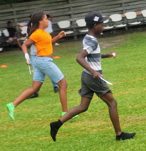 Boy and a girl running in a race. 
