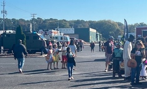 Children in costumes at the Touch-a-Truck event.