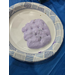  A glob of purple slime on a plate. 