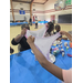 People stretching out pink and purple slime. 