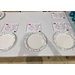  Empty plates with diagrams above. 