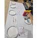  Four empty paper plates, with diagrams above the, and a cube built of gummies and toothpicks. 